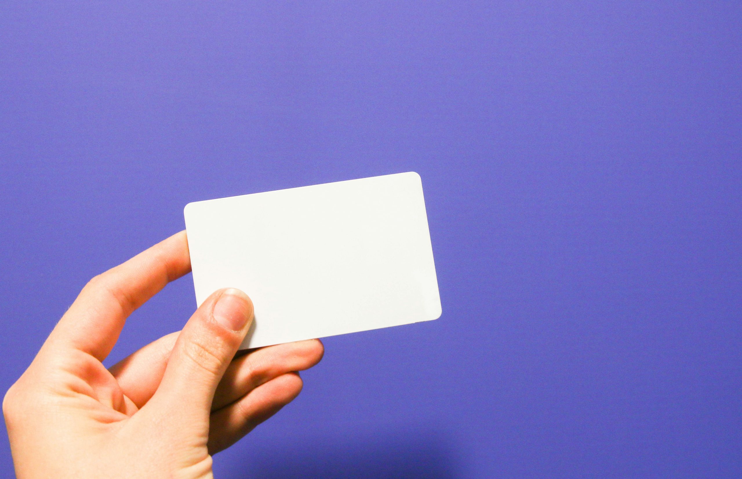 White gift card against purple background